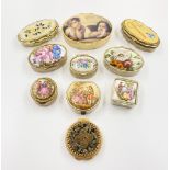 An Eclectic Mix of Ten Trinket/Pill Boxes. All have a gilded finish and are decorated with either