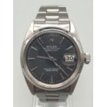 A ROLEEX OYSTER PERPETUAL DATEJUST IN STAINLESS STEEL WITH RARE BLACK FACE 36mm