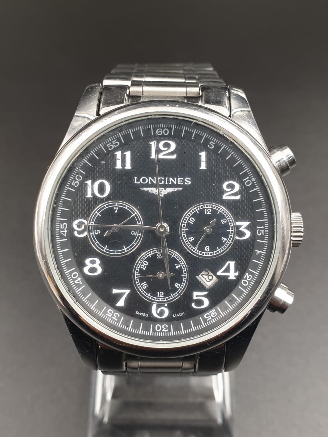 A Longines Automatic Chronograph Watch. Black dial. Stainless steel strap. 35mm case. Good condition