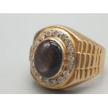 An 18k Yellow Gold Diamond and Large Oval Labradorite Ring. 20 small diamonds. Size S. 12.4g