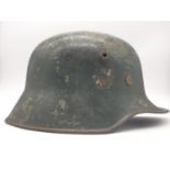 Transition Period German M17 Helmet. Lots of the original WW1 paint can be seen under the WW2 Make