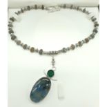 A stunning Labradorite pendant on a Tibetan silver and labradorite chain. Presented in a case.