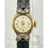 A LADIES VINTAGE ROLLLED GOLD DRESS WATCH WITH LEATHER STRAP.A/F