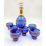 A Murano Venetian Glass Wine Set. A Decanter with six glasses. Blue glass with gilded decoration.