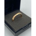 Hallmarked 22 CARAT GOLD ring in plain band form. 5.8 grams.Size N.