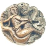 An Archaic, Oriental style, fertility amulet, depicting a -beautifully carved in stone- couple in