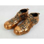 A Pair of 1950s Style Brass Football Boots. Comes in a wooden presentation box.