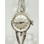 A 14K White Gold Ladies Dress Watch, Made by Tourist. Beautiful snake-link bracelet strap. Silver-