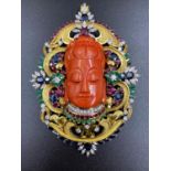 A 14K GOLD DIAMOND LARGE BROOCH/PENDANT WITH A BUDDHA HEAD IN CORAL AND DECORATED WITH SAPPHIRES ,