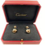 A PAIR OF CARTIER CUFFLINKS IN 3 COLOURS OF 18K GOLD IN ORIGINAL CARTIER PRESENTATION BOX. 22.1gms