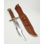 An African Hunter Branded Hunting Knife. German made. Wood and brass handle. 21cm length of blade.