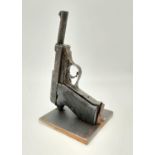 Paper Weight made from a Normandy Relic German Walther P-38 Pistol. Welded to a solid piece of