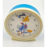 An Early 1970s Donald Duck Alarm Clock. Made by Bayard. Moving head as clock ticks. Excellent