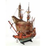 A model of a galleon in need of repair and restoration. Length: 60 cm, height: 65 cm.