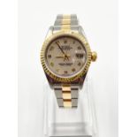 A LADIES ROLEX OYSTER PERPETUAL DATEJUST WITH UNUSUAL PATTERNED FACE AND NUMBERS IN BI-METAL. 26mm