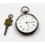 A Small Antique Silver Pocket Watch. Markings of 935 Silver. Comes with key - Has marking of Stephen