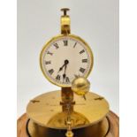 A Rare German Briggs Rotary Flying Ball Pendulum Table Clock. Mounted on a wooden disc base with