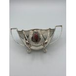 Vintage SILVER twin handled bowl ,standing on four lion paw feet and having chased design to