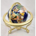 A Lapis Lazuli, Gemstone and Gilt World Spinning Globe. Very good condition. Diameter of globe 22cm.