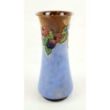 An Art Nouveau Royal Doulton Vase. Pale blue glaze with floral decoration. 25cm tall