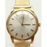 A 1960s Omega 5 Series Gold Watch. Gold plated concertina strap. Gold case - Silver tone dial.