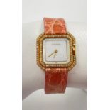 A Vintage 18k Gold Square-Tank Cartier Ladies Watch with Diamond Surround Bezel. 18k Yellow gold
