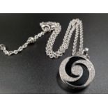 A Bulgari 18K White Gold Spinning Diamond Onyx Optical Illusion Pendant on an 18K White Gold Link