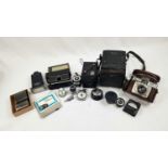 A Vintage Selection of: Cameras, Light Meters, Lens and Self Timers. Please refer to inventory photo