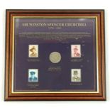 A Winston Churchill Stamp and Coin Set. In frame - 34 x 31cm.