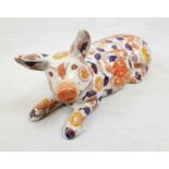 An IMARI palette, ceramic pig, modelled recumbent, six character mark to base. Length: 33 cm. (