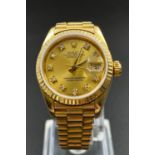 A Gold Rolex Oyster Perpetual Datejust Ladies Watch. 18K yellow gold strap and case - 23mm. Gold-