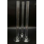 Nine Glass Flute Vases. 50cm tall. Preferable if picked up from Potters Bar location. Good