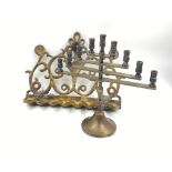 Two Vintage, possibly Antique Brass Menorahs. Different styles. 28x 22cm and 22 x 22cm.