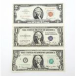 Three Uncirculated Dollar Notes: A 1963 red ink 2 dollar bill, a 1935 blue ink 1 dollar bill and a