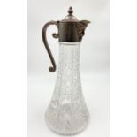 An Antique Cut Glass and Silver Plated Claret Jug. 29cm tall. Good condition but A/F.