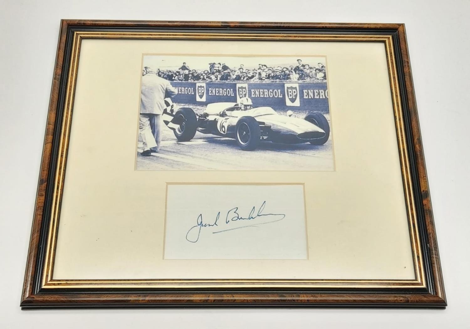 Three Time Formula 1 Champion Jack Brabham Autograph and Picture Piece. In frame - 34 x 29cm.