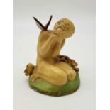 A Vintage, possibly Antique Girl and Butterfly Figurine. Markings on base. Condition as per