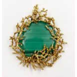 A 13ct Disc of Malachite Backed on a Nest of 18K Yellow Gold Pendant. 5 x 6cm. 33.79g total weight.