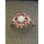 9 carat gold Opal and Ruby cluster ring.2.3 grams.Size K 1/2.