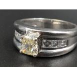 An 18K White Gold Diamond Ring. Centre diamond .70ct SI1/VG - EX. Plus .60ct of surrounding