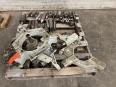 Lot of assorted machine tool accessories, including assorted steady rests, centers, and chucks