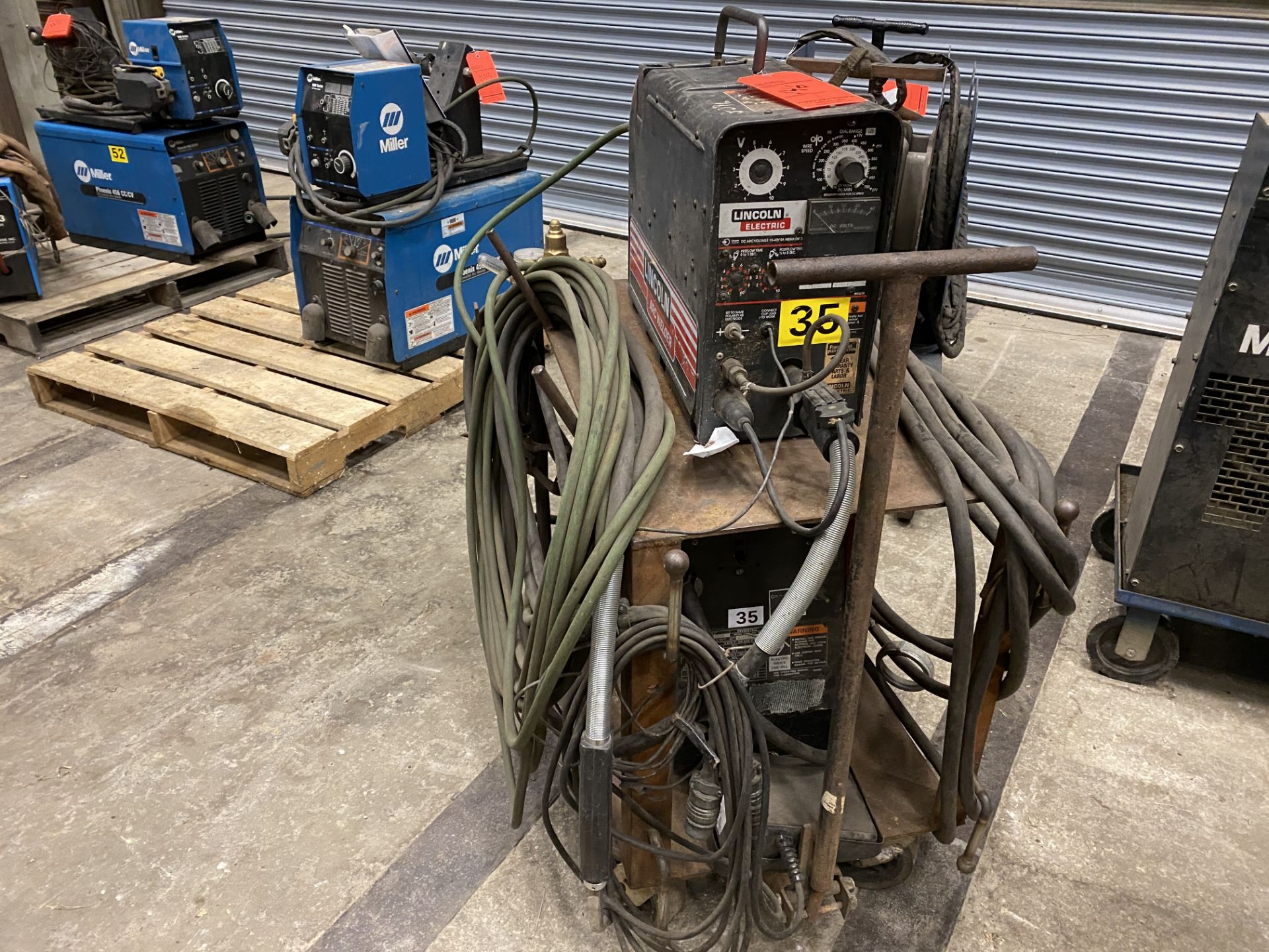 Lincoln Invertech V 300-Pro arc welder SN U1950781376 with a LN-25 wire feeder on rolling cart