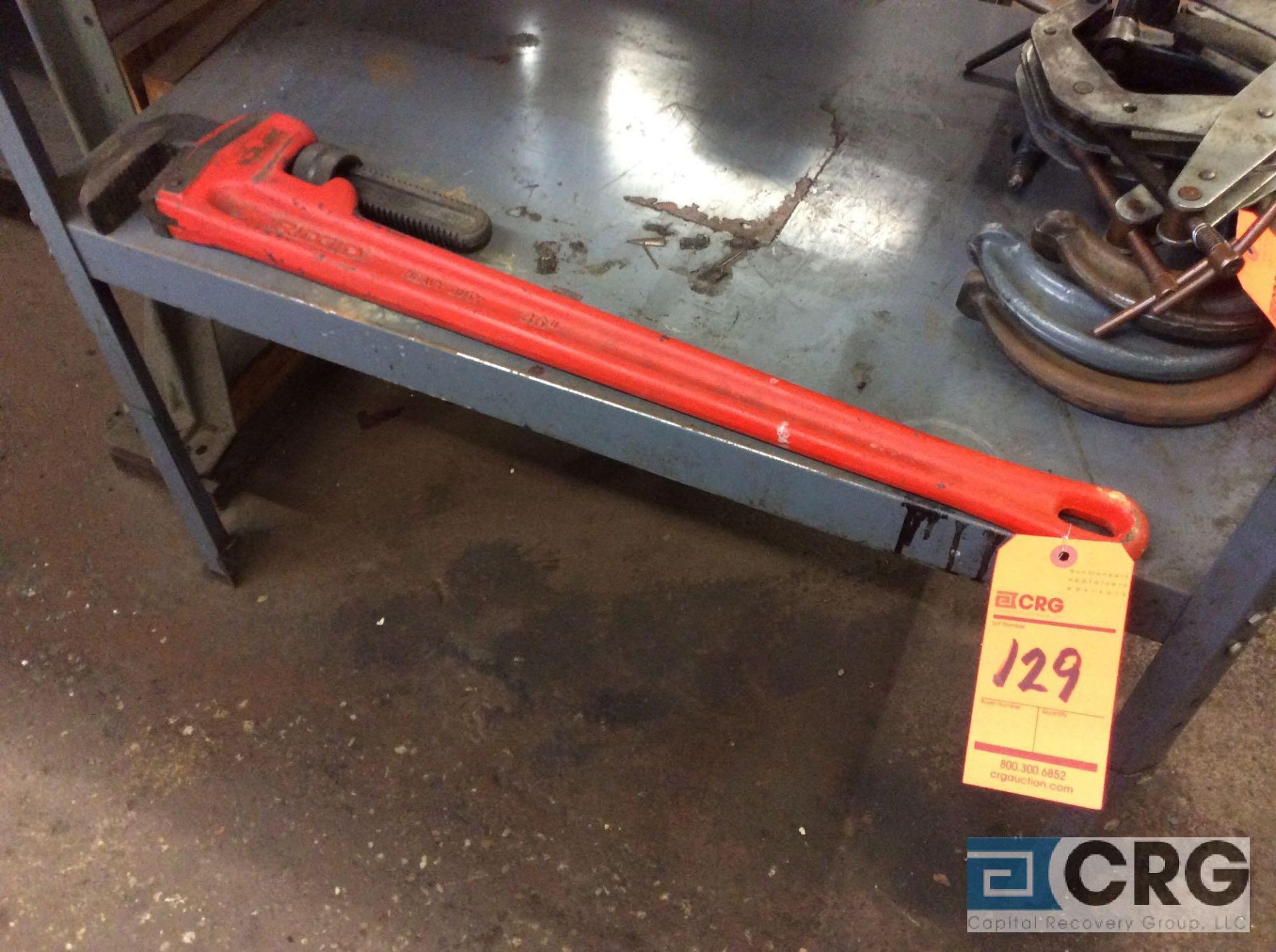 Ridgid 24 inch pipe wrench and (5) asst clamps (LOCATED IN TOOL ROOM MACHINE SHOP)