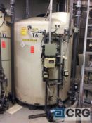 Approx 1000 gallon alkaline treatment poly storage tank (LOCATED ON 1ST FLOOR CHEMICAL MIXING)