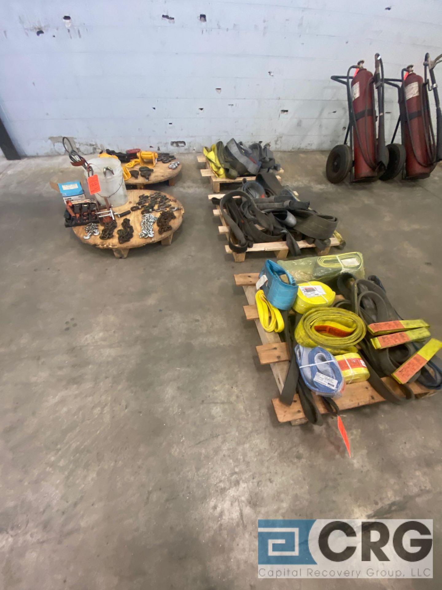 Lot of assorted rigging, strapping, and hoisting equipment, including (6) lengths of chain, (1)