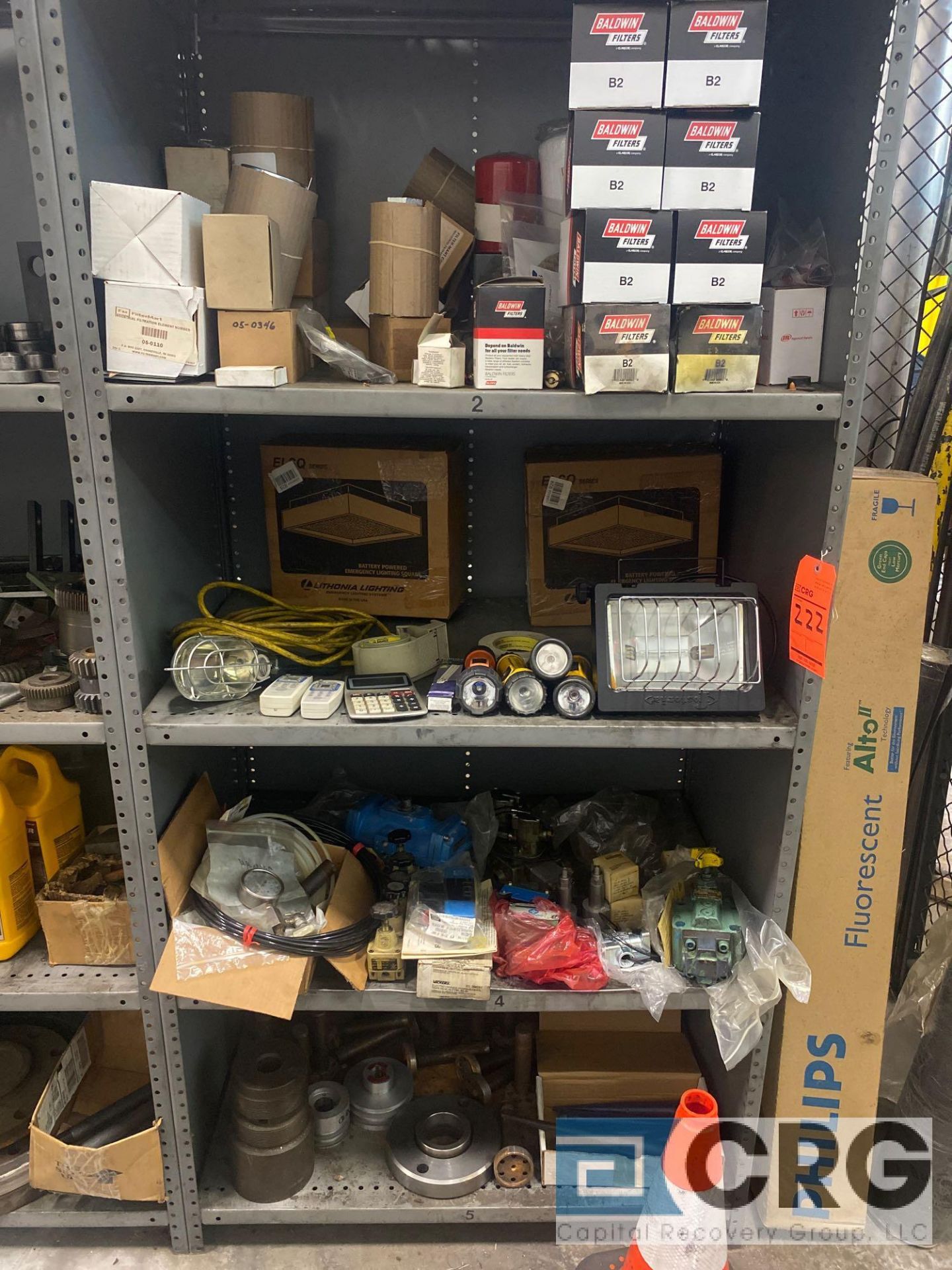 Lot of assorted pneumatic pieces, machine parts, small electrical items, lights, oil filters, copper