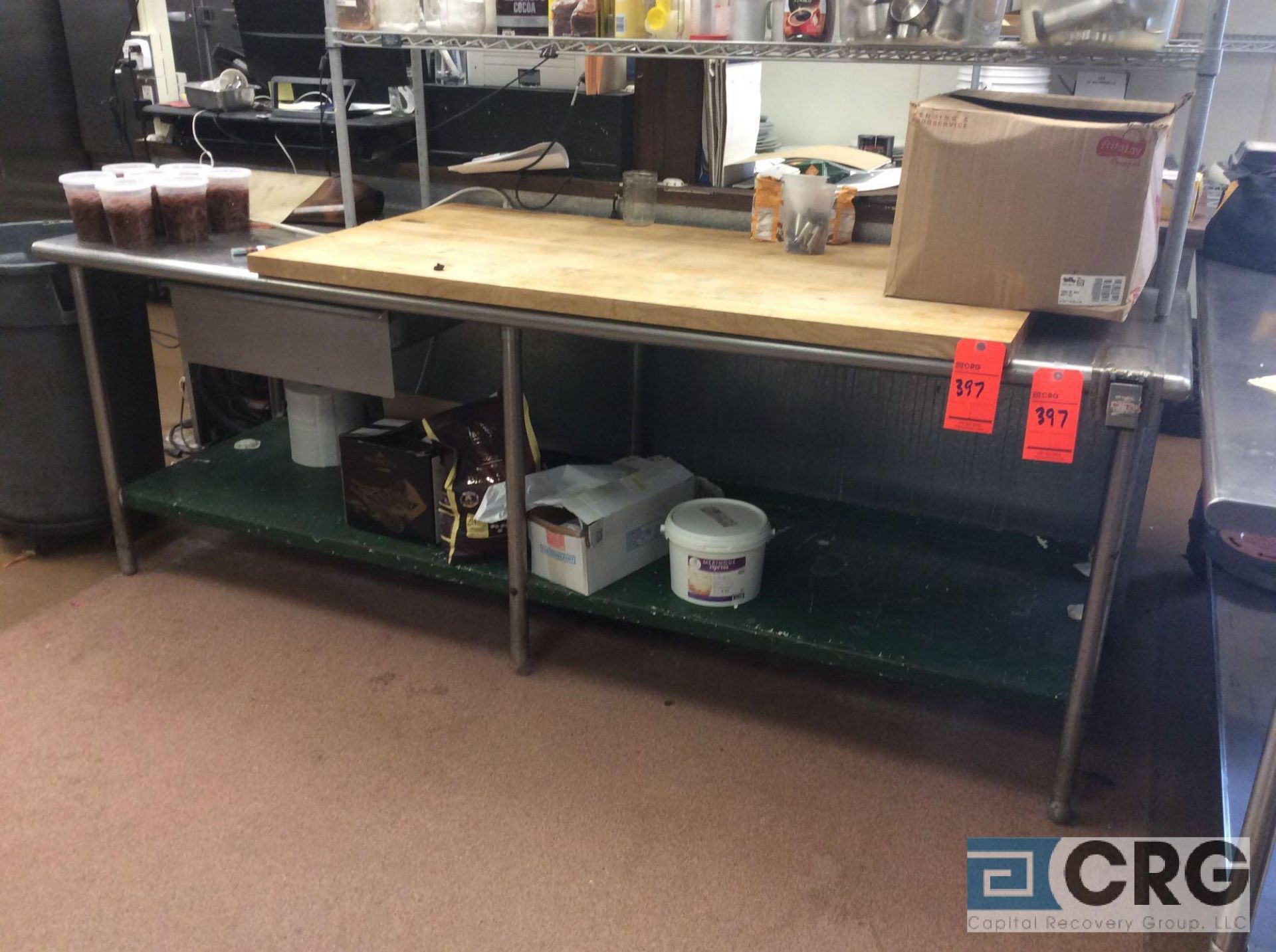 8 foot stainless steel work table with 5 foot butcher block top (no contents)