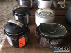 Lot of cooking appliances including (2) pressure cookers, (1) crock pot and (1) dehydrator