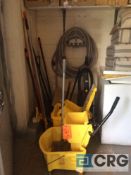 Lot of cleaning supplies, mop buckets, brooms, vacuum cleaner