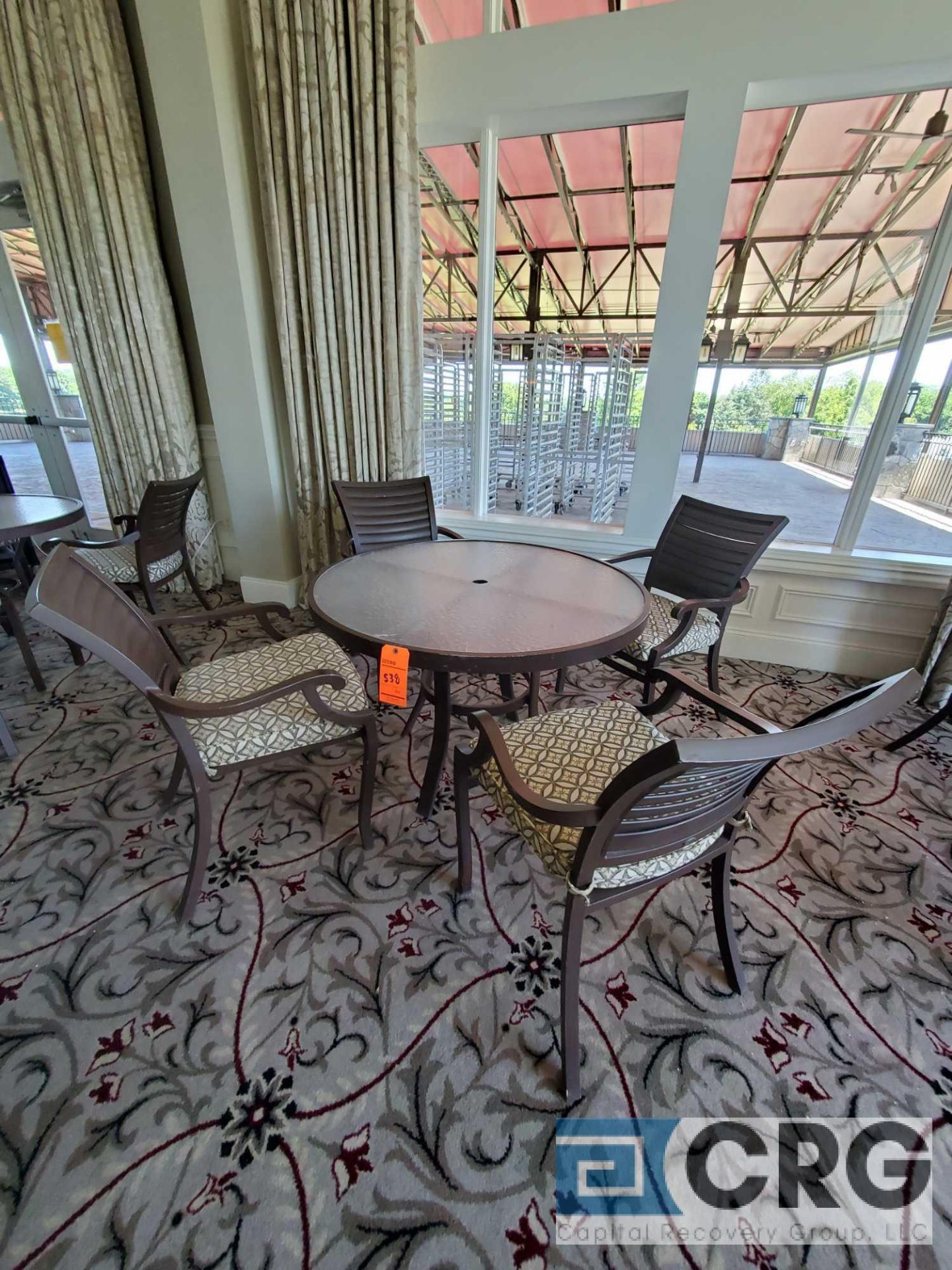 5 piece set of outdoor furniture including (4) metal chairs with cushions, and (1) table 43 in.